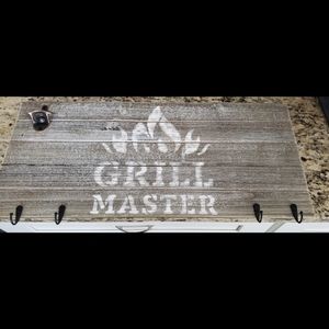 Bbq sign with utensil  holders and a bottle opener. Grey, black and  brown